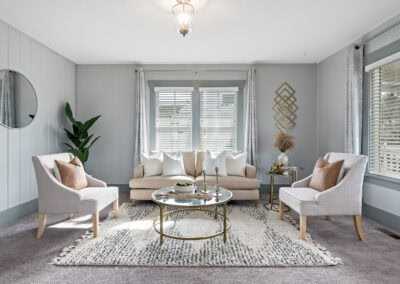 Living room with sunlight streaming through by PNW Visuals